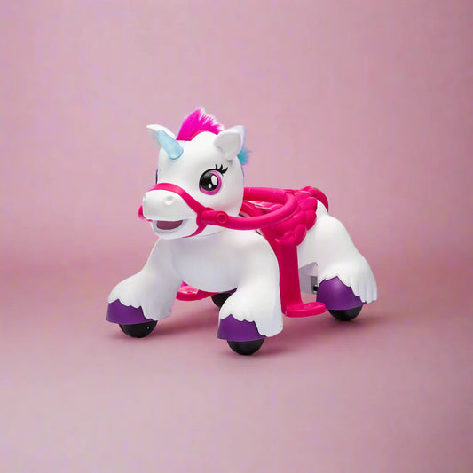 Toy  ride on unicorn with pink and purple accents on a pink background