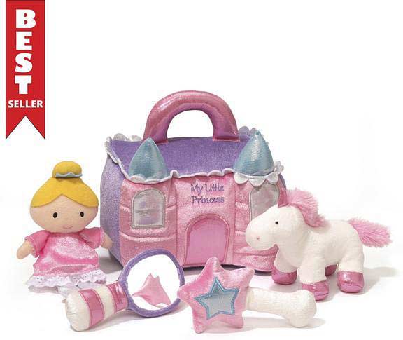 This is a plush "My Little Princess" play set featuring a soft pink-and-purple castle carrying case with handles. It includes 4 plush accessories: a small princess doll in a pink dress, a white unicorn with pink accents, a mirror rattle, and a wand/star rattle.