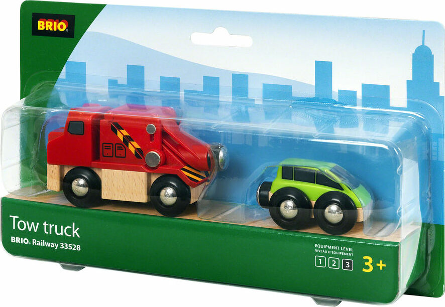 A packaged BRIO Tow Truck toy set featuring a red tow truck and green car, with the BRIO logo and age recommendation visible.