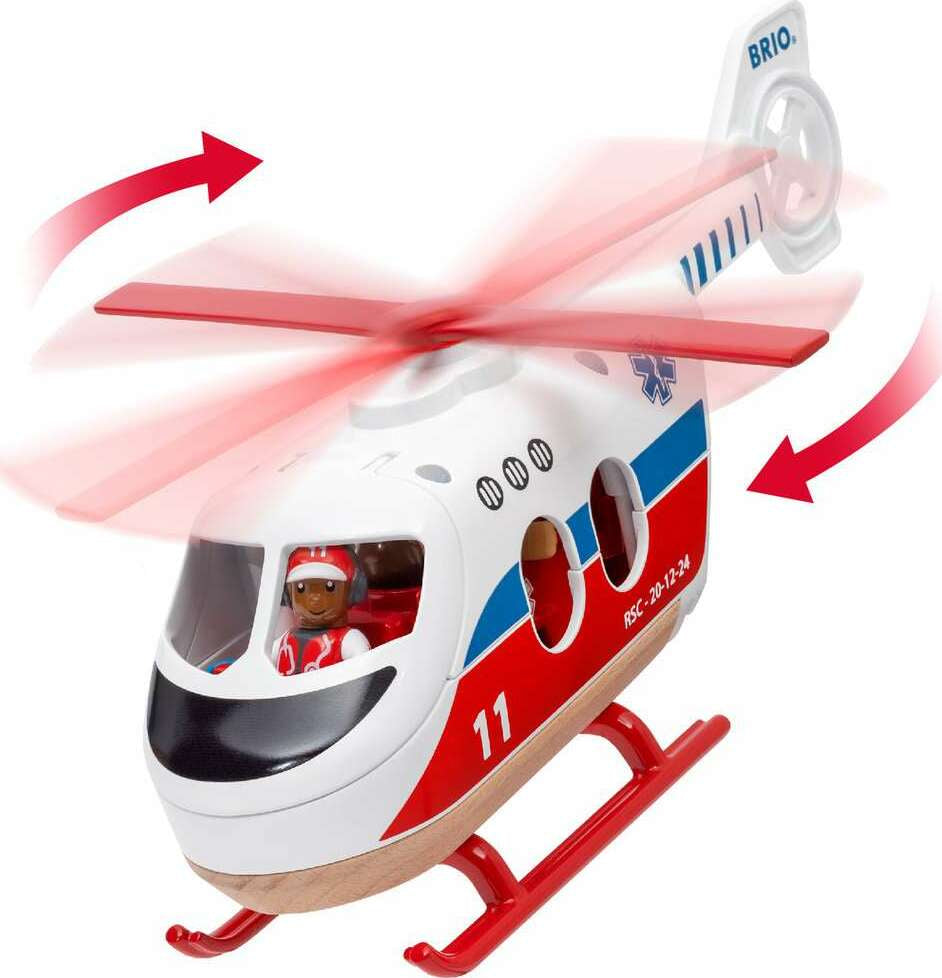 Toy helicopter with spinning propellers and a figurine inside on a white background