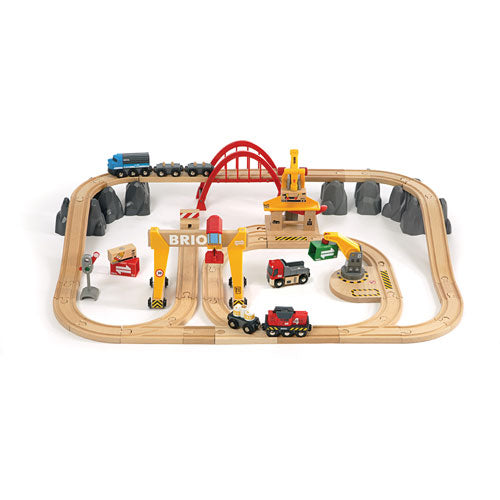 A 50-piece BRIO Cargo Railway Deluxe Set with tracks, train, and various vehicles including a loader and cranes, displayed on a white background.