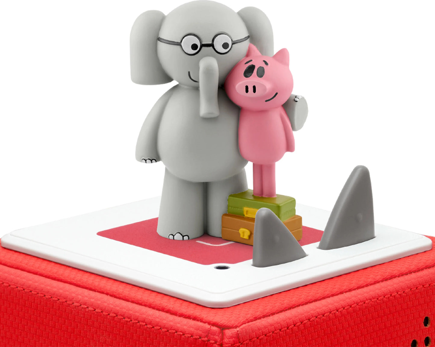 Toy figure of a gray elephant and pink pig on a red and white base