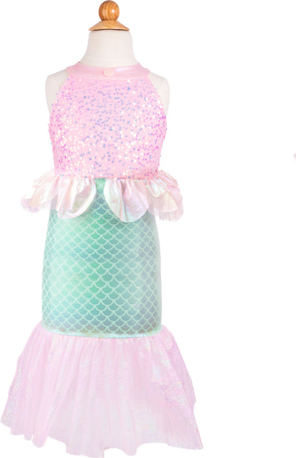 Mermaid-themed dress with pink top and green tail on a mannequin against a white background. It has sequin on the top and scales on the bottom, with a pink ruffled "fin" 