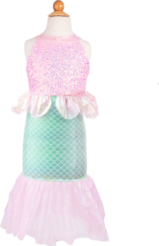 Mermaid-themed dress with pink top and green tail on a mannequin against a white background. It has sequin on the top and scales on the bottom, with a pink ruffled "fin" 