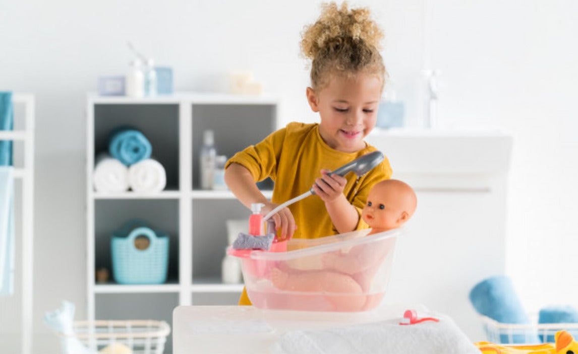 Emma Drink-And-Wet Bath Baby - Corolle  
Doll in bathtub