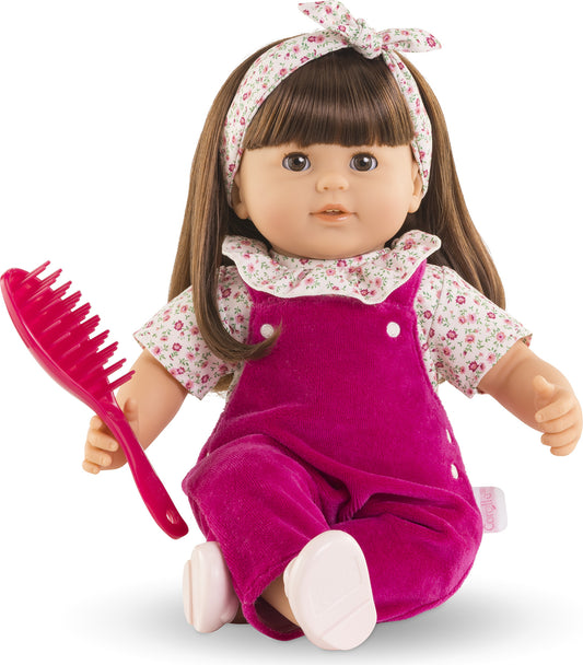 Julie - Pink Grenadine
14 inch brunette doll wearing floral shirt and magenta corduroy overalls. Comes with hair brush and floral headband.