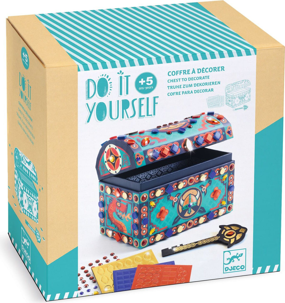 A boxed craft kit labeled 'Do It Yourself' showing a decorative chest to decorate. The retail box is tan and teal with a large photo of an ornate blue treasure chest, decorative embellishments, a key, and small colored sheets.