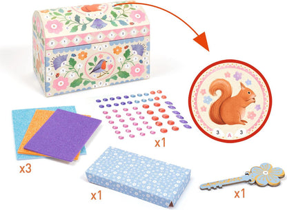 A children's puzzle box set with a decorated floral and bird-themed box, a blue patterned box, a key, colored cards, round stickers, and a circular squirrel illustration inset, shown on a white background with quantity labels.