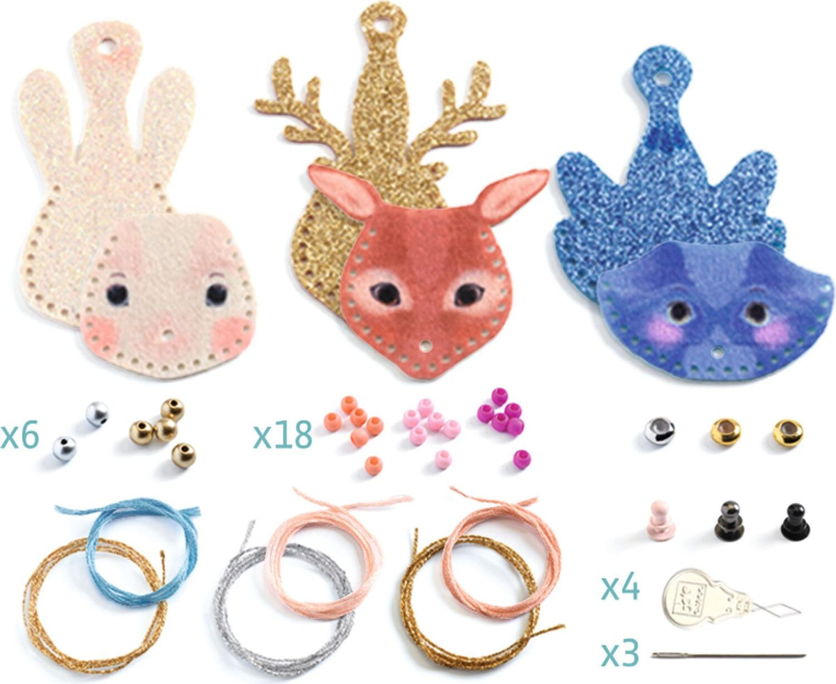 Feeling craft kit containing three felt animal faces (rabbit, deer, cat) in glitter and fabric, beads, thread spools, and small accessories, displayed on a white background with quantity labels.