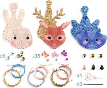 Feeling craft kit containing three felt animal faces (rabbit, deer, cat) in glitter and fabric, beads, thread spools, and small accessories, displayed on a white background with quantity labels.
