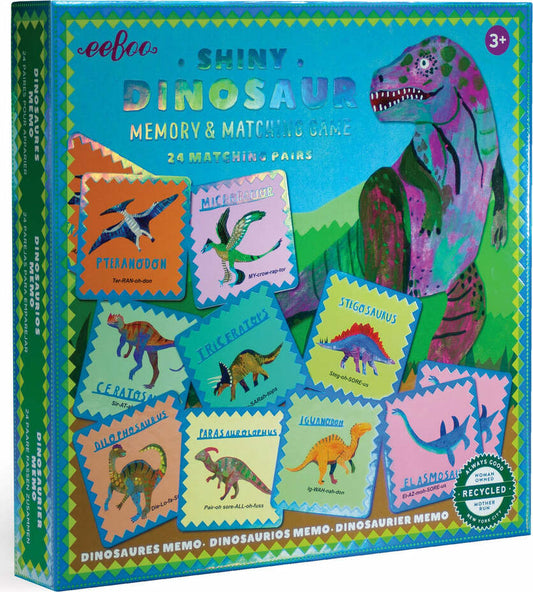 Boxed Shiny Dinosaur Memory and Matching Game with colorful dinosaur tiles visible and a dinosaur illustration in the background.