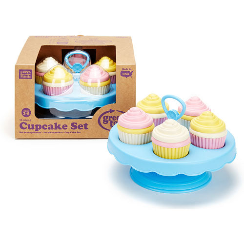 A toy cupcake set consisting of a blue stand with colorful toy cupcake, shown both assembled on the right and inside it's cardboard packaging box on the left.