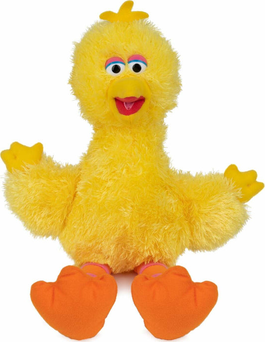 Yellow plush duck toy with orange feet on a white background