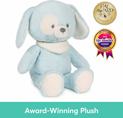 sky-blue plush puppy sits upright, To its right, two award seals are displayed: a circular gold "PAL Award" emblem above a colorful ribbon badge that reads "Toy Insider Winner 2023." Across the bottom, a teal banner features the text "Award-Winning Plush" in white.