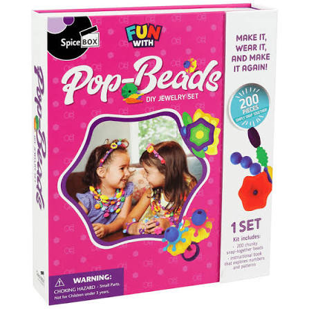 SpiceBox Pop-Beads DIY Jewelry Set box, featuring a bright pink and white packaging design with colorful bead illustrations and a photo of two children wearing beaded necklaces.