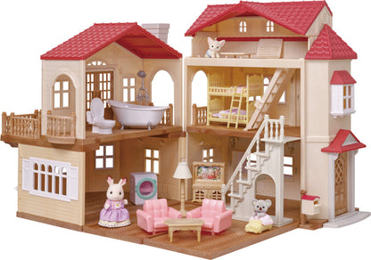 Toy dollhouse with detailed furniture and accessories on a white background