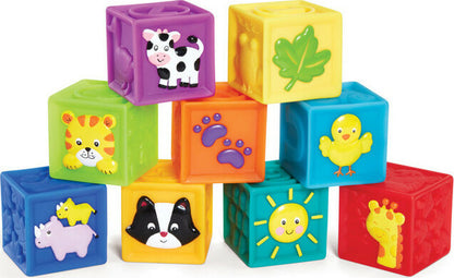A set of colorful stacking blocks with embossed animal, shape, or character faces on each side, and a textured bottom. Each block is soft and squeaky, designed for sensory development in young children.