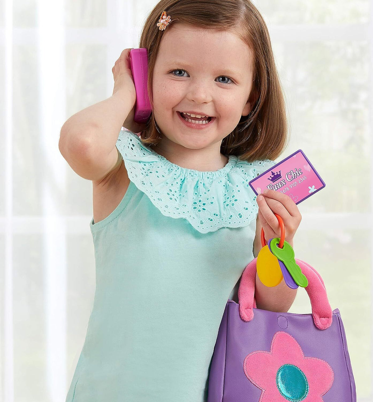 Capture the magic of make-believe with the Kidoozie My First Purse. This delightful set is perfect for your little one, featuring a charming soft purse, a play cellphone, a debit card, and a set of plastic keys. Whether she’s pretending to shop, run errands, or head out for a busy day, this set encourages hours of creative and imaginative play. Perfect for toddlers and preschoolers who love to