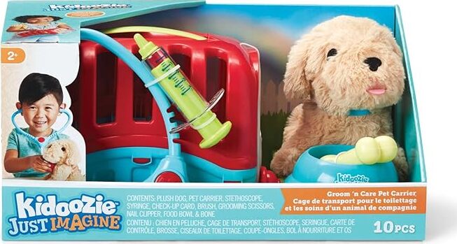A packaged toy set including a plush puppy and a pet carrier with grooming accessories like a syringe, bandage, and brush. The toy set is designed for children with an emphasis on pretend play as pet owners or veterinarians.