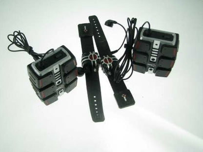 Set of electronic components including a watch and battery packs on a white background