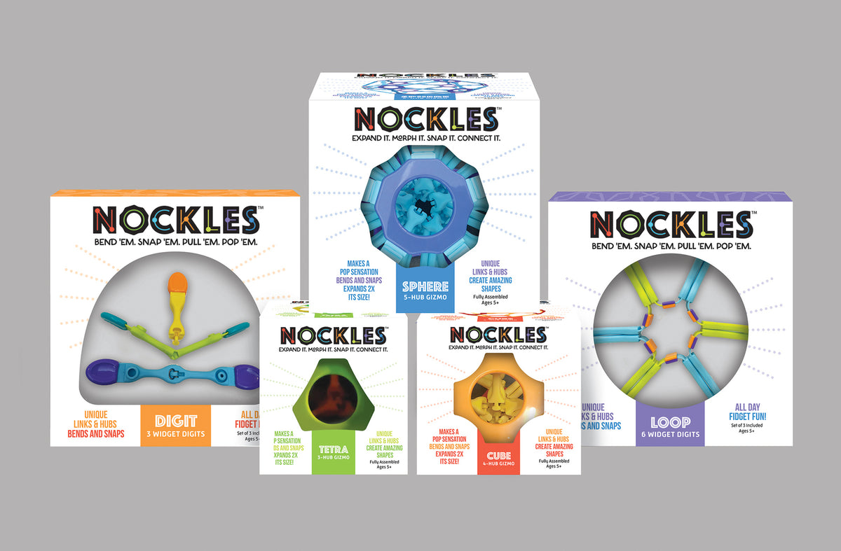 Multiple boxes of Nockles toys on a gray background