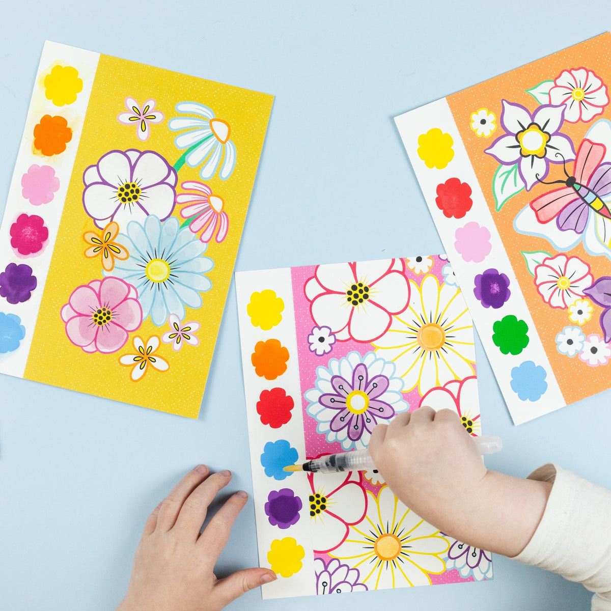 Children's activity with colorful flower stickers on a light blue background