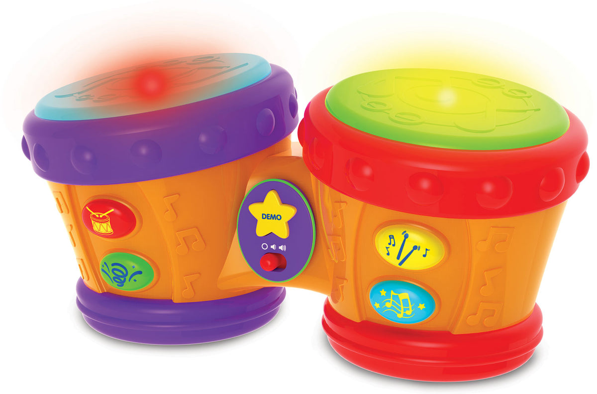 Colorful toy drums with lights and buttons on a white background