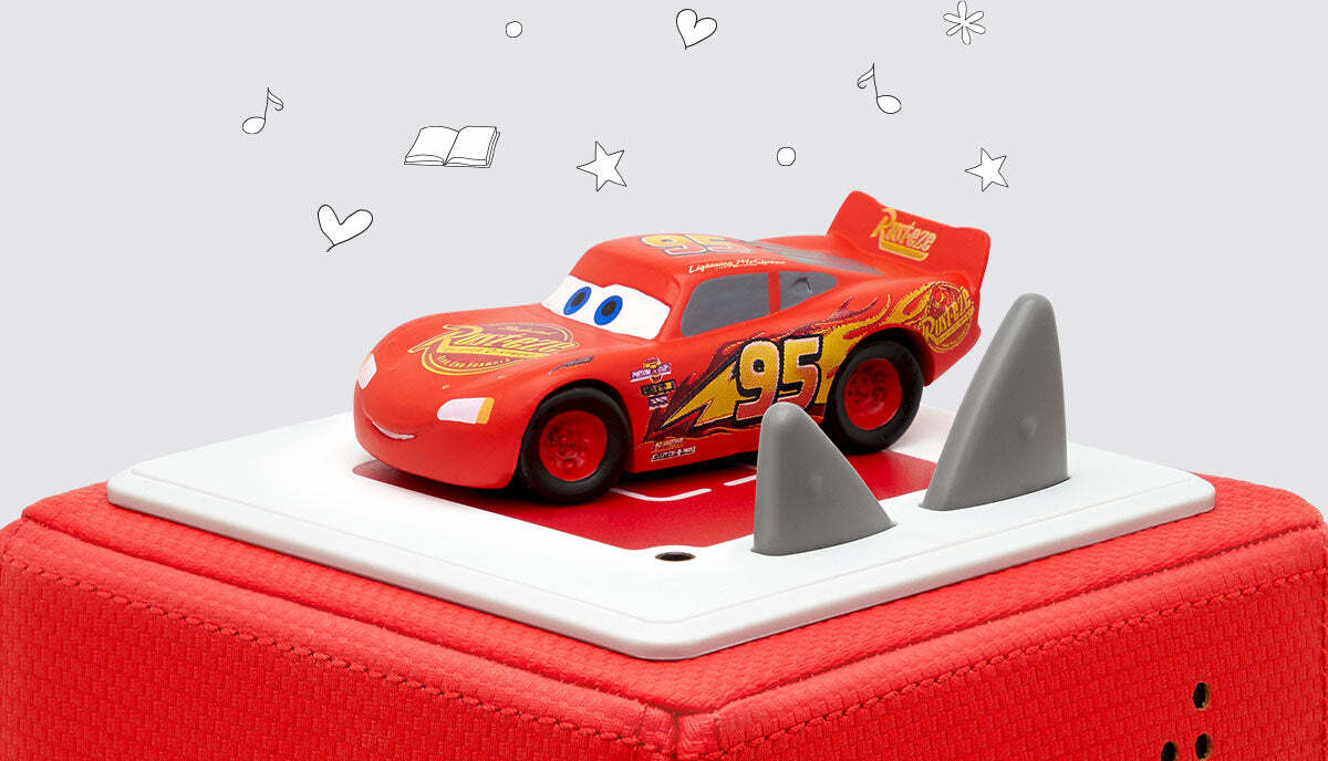 A toy figure of Lightning McQueen from Disney and Pixar's Cars movie, predominantly red with number 95 and the Radiator Springs logo, on a red tonie box