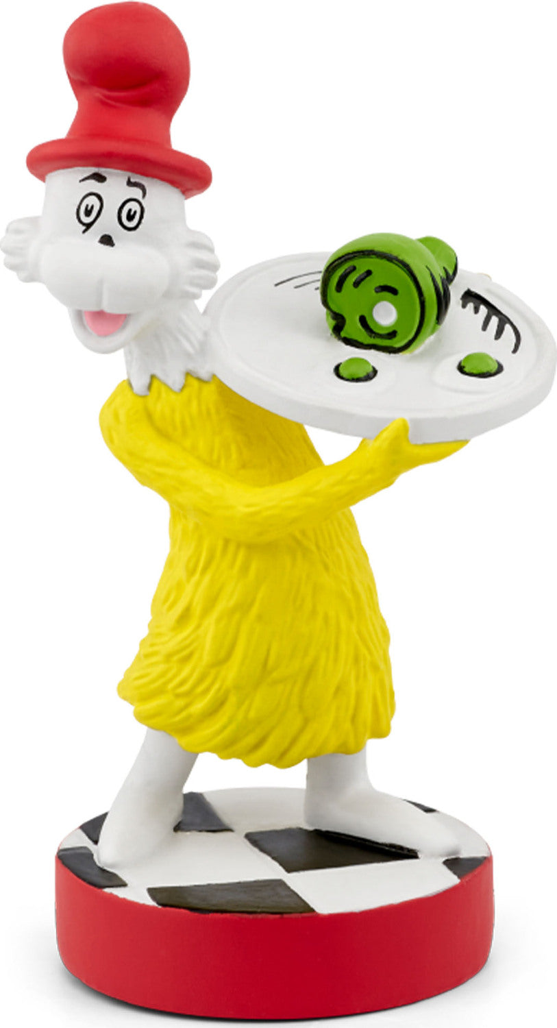 Cartoon character figurine with a yellow dress and red hat on a white background